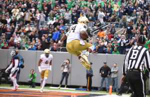 Since-graduated Notre Dame quarterback DeShone Kizer clicks his heels in celebration after running for a 3-yard score during Syracuse's 2016 matchup with the Irish.