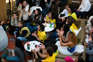 Students of Syracuse’s Brazilian Student Association, including co-Presidents Isabella Loschiavo and Maria Cardoso, celebrate their team scoring. The members expressed national pride by singing popular Portuguese songs, wearing Brazil colors and green glitter face art.