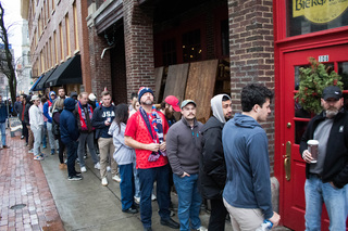 A line of fans wait for a spot in Wolff’s Biergarten during the U.S. team’s final round. The pub filled to capacity over half an hour before the game began.
